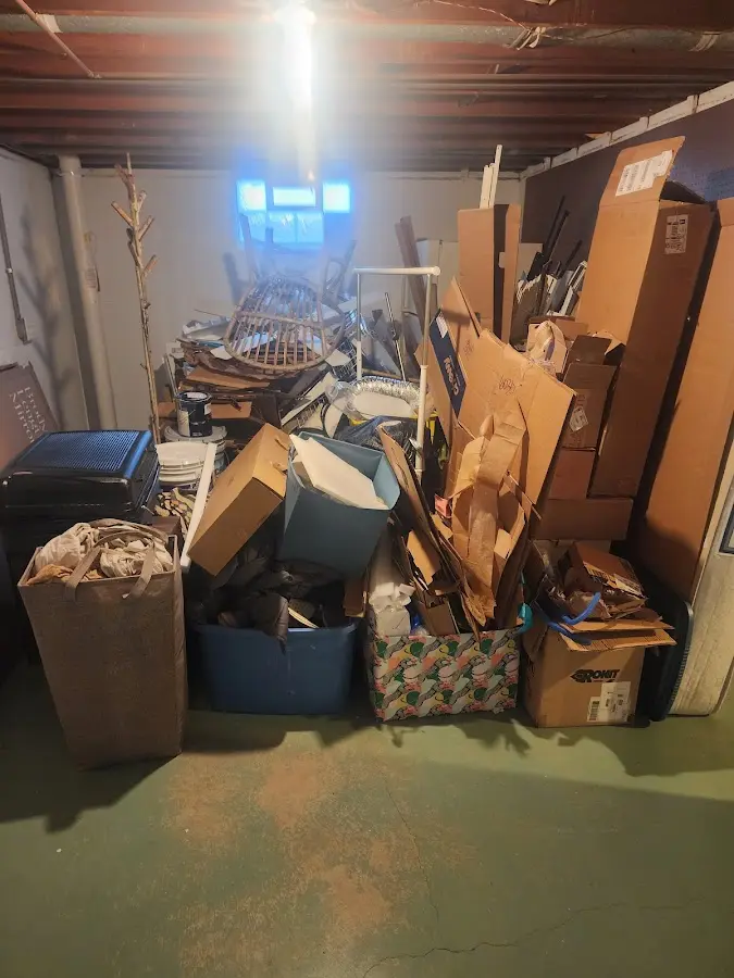 Roll-off dumpster container at job site for 2 Yard Dumpster Rental in Jordan